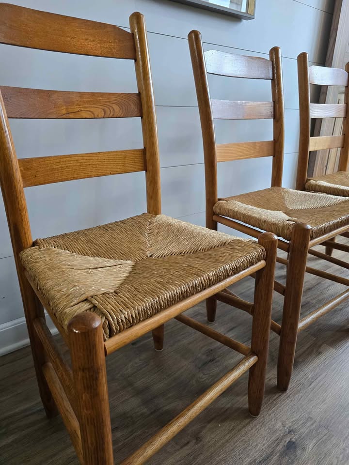 Beautiful set of 3 solid wood ladderback chairs with classic woven rush seats.